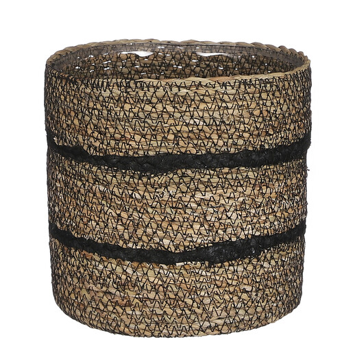 Close-up view of woven seagrass plant pot with black striped bands