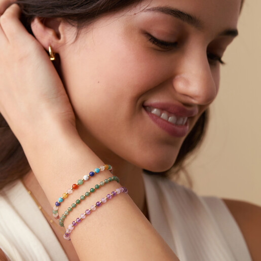 Model wearing the colourful beaded Amelia bracelet stacked on her wrist