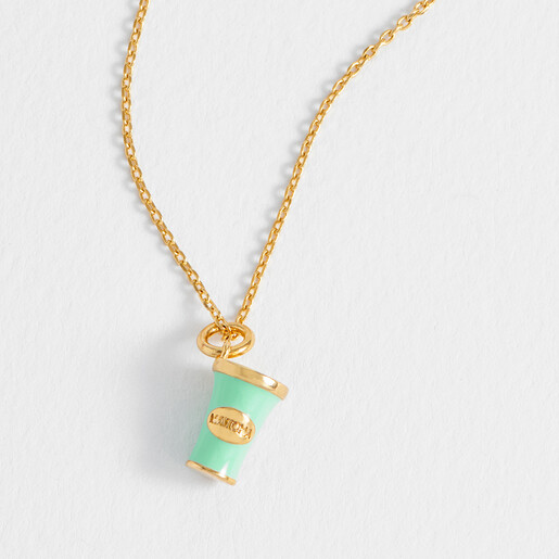 Close-up of gold plated matcha cup pendant with mint green enamel detailing
