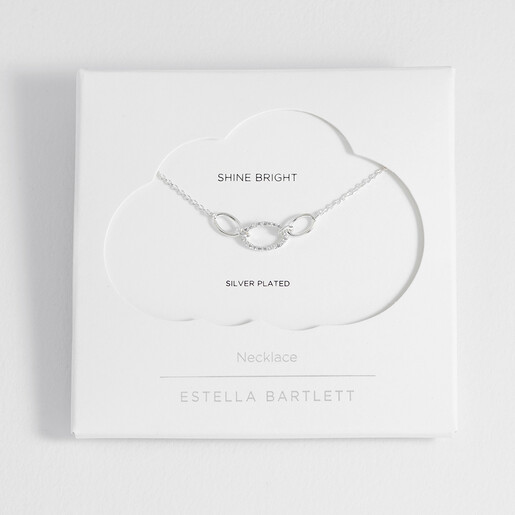 Estella Bartlett silver necklace presented in cloud packaging with Shine Bright text.