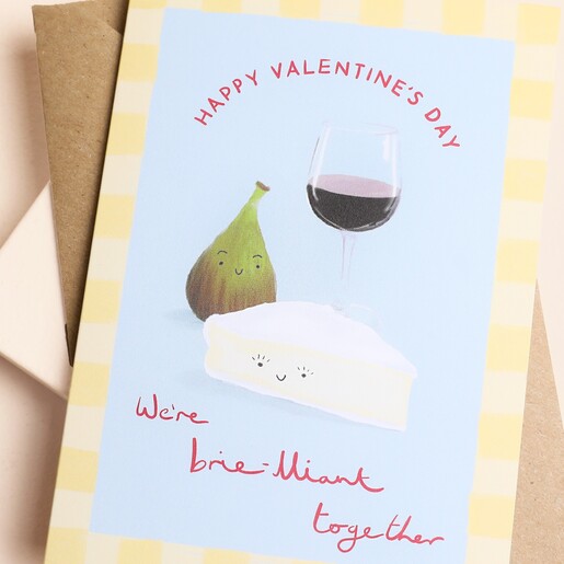 Close up of the illustrated brie and wine pun Valentine's card