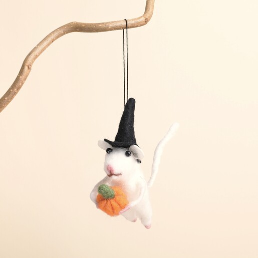 Felt Halloween mouse hanging from a branch holding a pumpkin