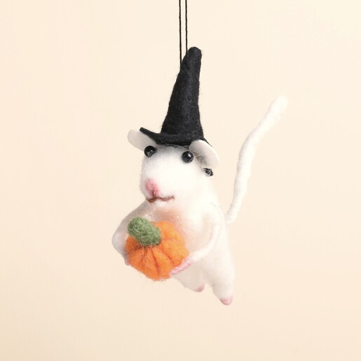 Close up of felt white mouse decoration holding an orange pumpkin