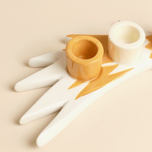 Close-up of the glazed ceramic shooting star candle holder cups and tail