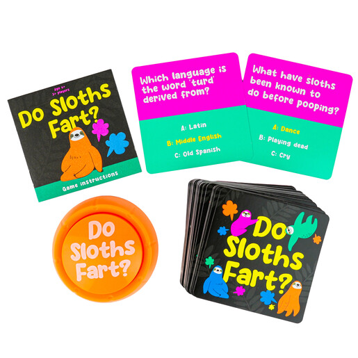 Do Sloths Fart game cards, instruction booklet, and orange buzzer button on white surface.