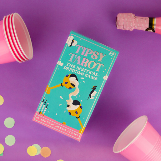 Tipsy Tarot drinking game packaging box lying flat with pink party cups