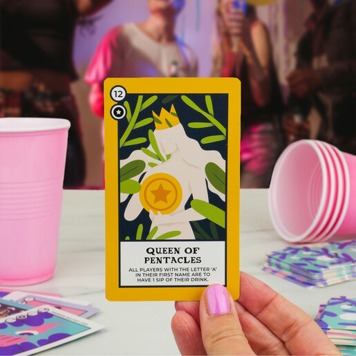 Hand holding a Queen of Pentacles card from the Tipsy Tarot game
