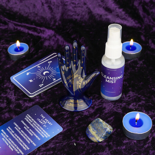 Ceramic palmistry hand figurine with instructional card, blue tealights, mist, and crystal