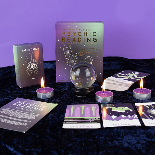 Host your own psychic reading night kit with tarot cards and lit candles