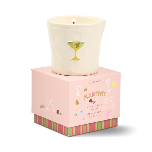 Paddywax Bistro martini candle lit on top of pink gift box