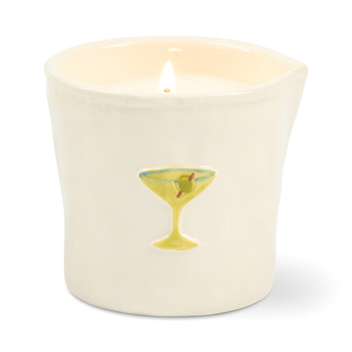 Close up of off white ceramic candle pot with embossed martini glass motif
