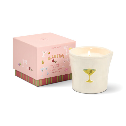 Lit ceramic candle standing next to pink illustrated bistro gift box