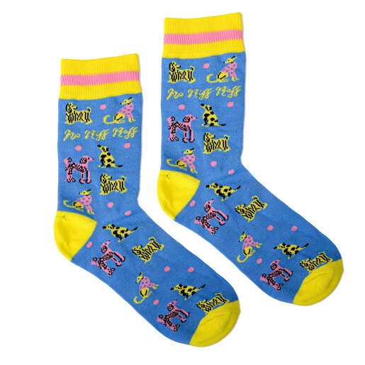 Pair of blue dog patterned crew socks with yellow heels and cuffs