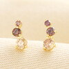 Pair of gold plated climber stud earrings with graduating brown crystals