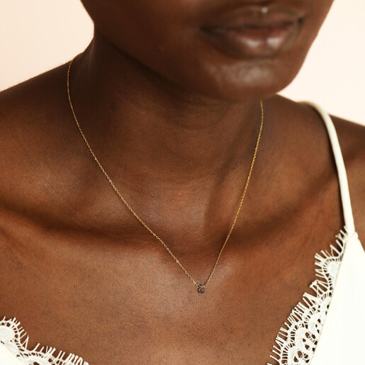 model shot of earthy pendant necklace in gold