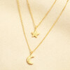 Gold double layered necklace with brushed star and crescent moon pendants