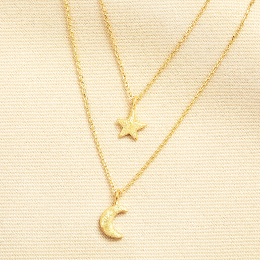 Gold double layered necklace with brushed star and crescent moon pendants