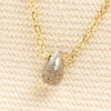 close up of semi-precious teardrop pendant