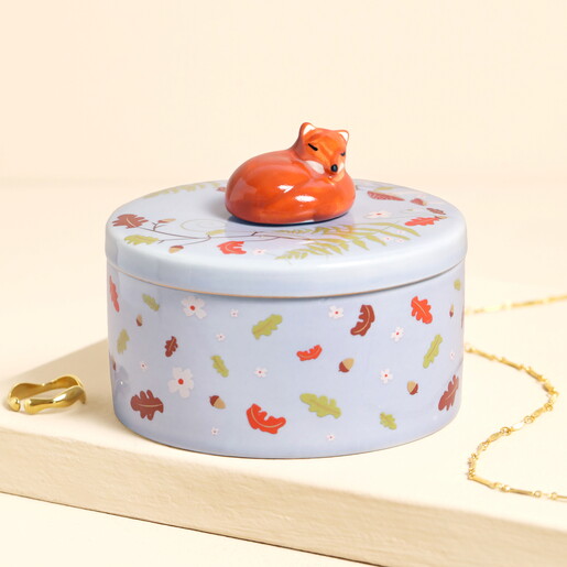Purple ceramic trinket pot decorated with woodland foliage and topped with a sculpted fox lid