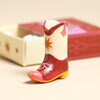 white and red cowboy boot token
