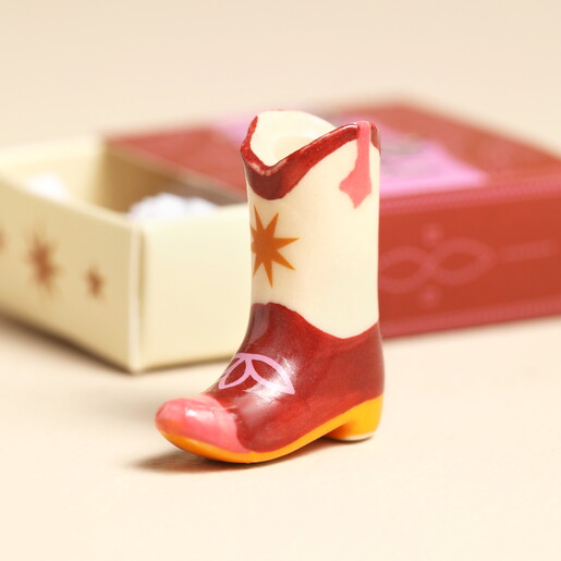 white and red cowboy boot token