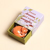 ceramic fox token inside packaging