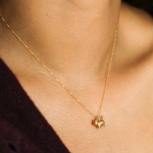 model shot of cat-shaped pendant necklace in gold