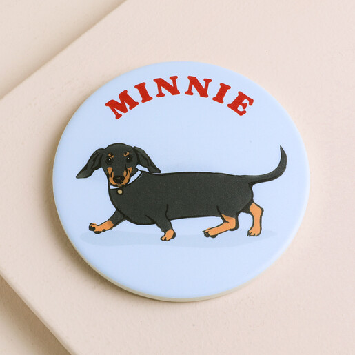 Personalised ceramic dog coaster in light blue with a dachshund illustration and name Minnie