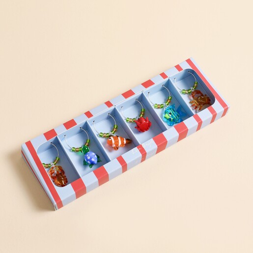 Set of six beaded sealife wine glass charms in a striped gift box.