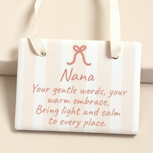 Close-up of ceramic plaque with Nana quote and cream ribbon hanging loop