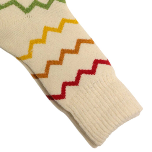 Detailed view of the ribbed cuff and coloured zig-zag pattern on cream socks