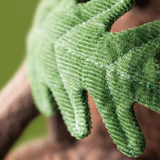 Close up of the green corduroy leaf detail on the plush acorn soft toy