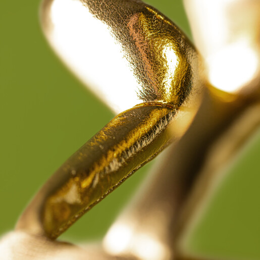 Detail of shiny metallic gold feet on the Jellycat lightning bolt soft toy