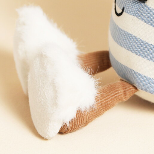 Close Up of Tiny Fluffy White Slippers on Tea Cup Plushie