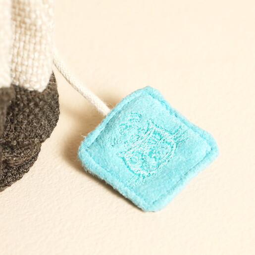 Close Up of Steep Tag With Embroidered Logo