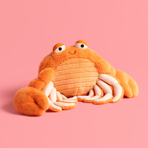 Fluffy Crab Plushie on Pink Backdrop