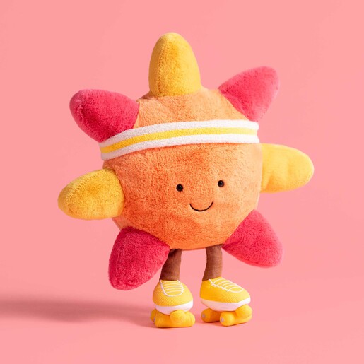 A Cuddly Sun Plush Toy Wearing Roller Skates and a Headband