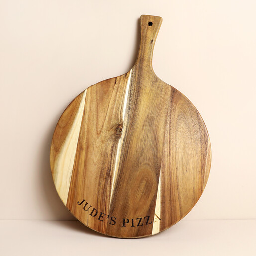 Round wooden pizza board with paddle handle and personalised engraving