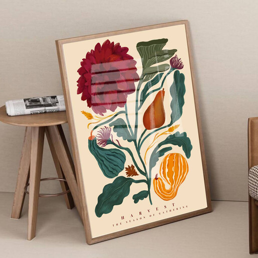 Framed Kate Fox Design harvest art print leaning on floor beside side table