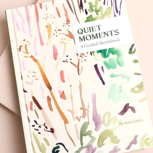 Front view of the Quiet Moments sketchbook featuring botanical cover design