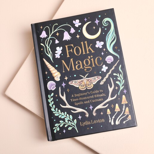 Folk Magic beginners guide hardback book with illustrated black cover