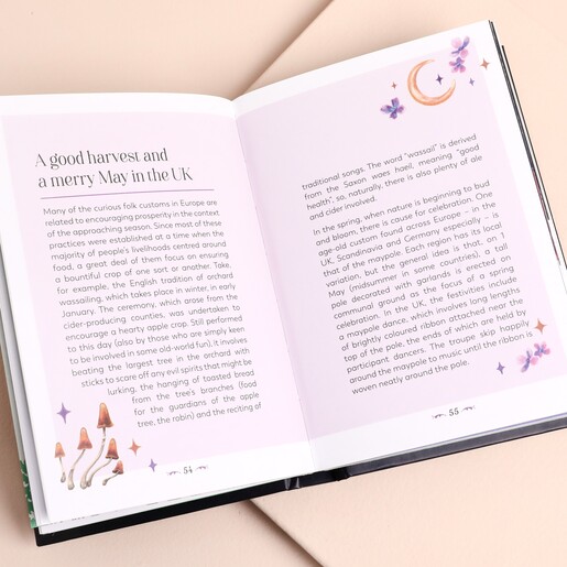 Open page of Folk Magic guide book with text and nature illustrations