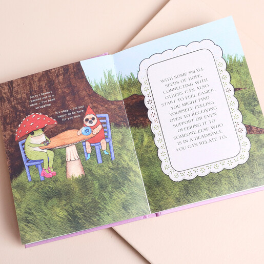 Open spread of The Little Frog's Guide to Hope book with colourful illustrations