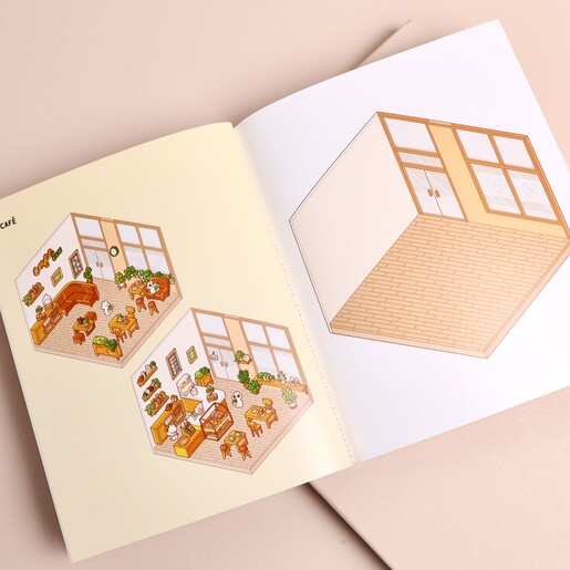Open sticker activity book displaying printed room templates and blank room layout to decorate