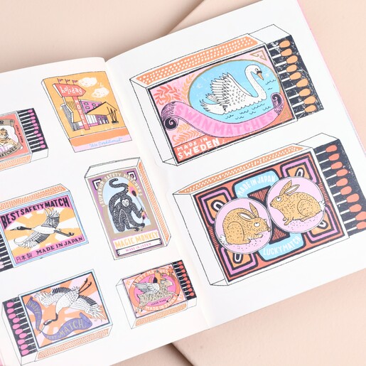 Open page of sticker book showing colourful vintage style matchbox illustrations.