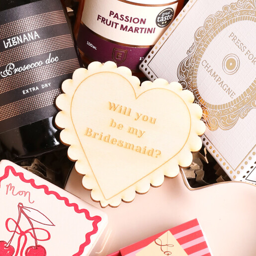 Close up of token outside of Build Your Own Bridesmaid Gift Hamper packaging