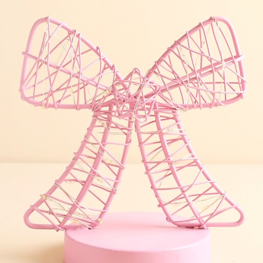 Close up of pink wire ribbon bow light showing intertwined wire details