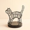 Black wire standing cat light with fairy lights on a round base