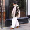 lifestyle shot of beige winter scarf