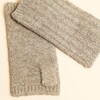 Close-up of neutral ribbed knitted fingerless gloves showing knit texture